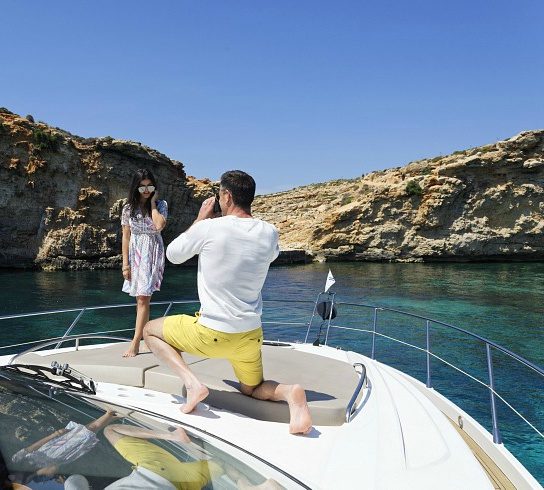young woman posing for a photo on a Sunseeker yacht in Malta