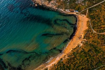 aerial photo of the golden sand and blue waters of Golden Bay Malta
