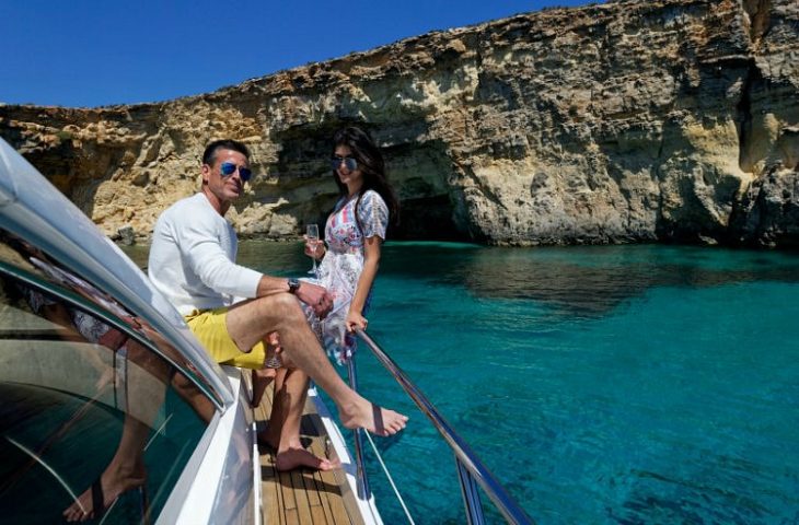 Guests enjoy views of the Mediterranean aboard a luxury Sunseeker motor yacht