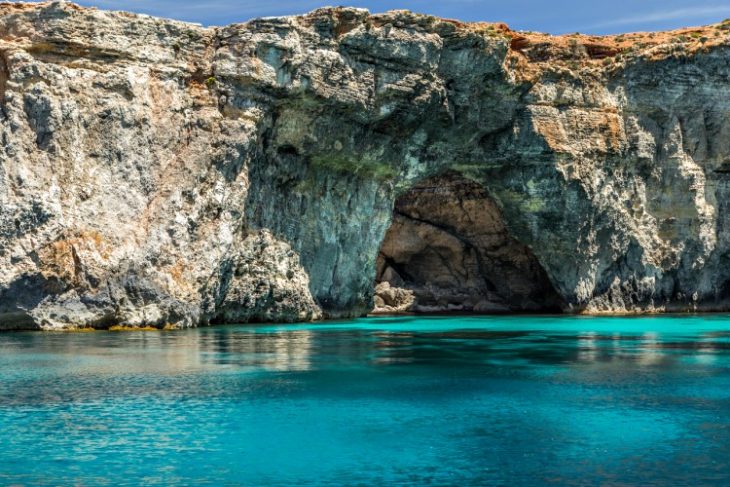 stunning waters and cave formations in Comino Crystal Lagoon